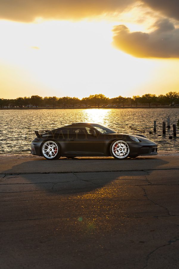 Front three-quarter view of the GT3 with the sun setting over Hillsborough Bay