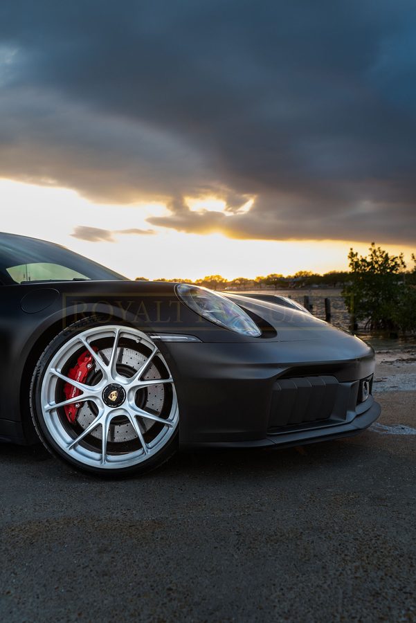 Front wheel and headlight detail of the GT3 at sunset
