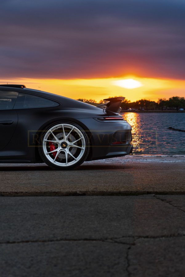 Rear-quarter detail of the GT3 wing at sunset