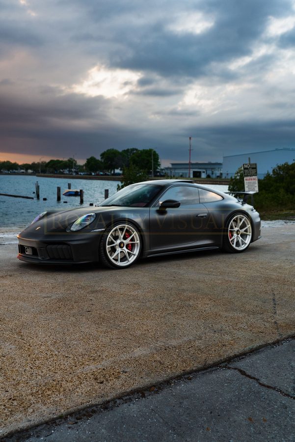 Front three-quarter of the GT3 at the boat ramp under storm light